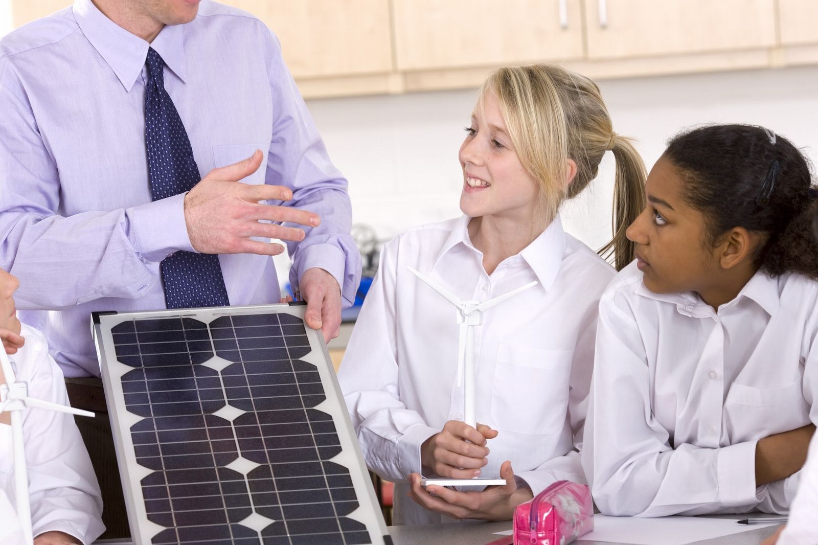 Teacher teaching solar to students
