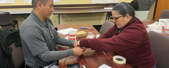 Teachers holding hands as part of a workshop exercise