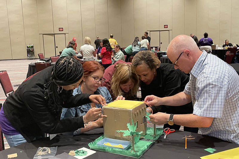 Teachers participating in an experiment at the National Conference
